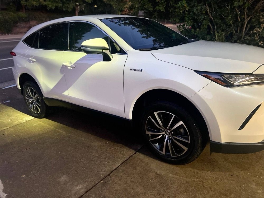 White Toyota SUV after detailing with polished paint and wheels