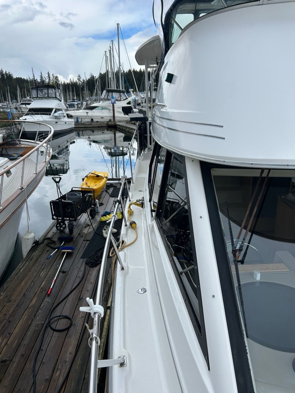 Freshly washed yacht at a marina dock